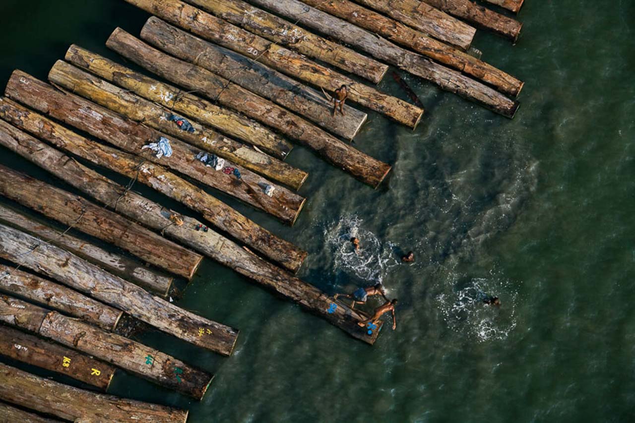 © Yann Arthus-Bertrand - Floating wood near Port-Gentil, province of Ogooué-Maritime, Gabon (0°43' – 8°47' E).